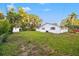 Spacious backyard with lawn and a shed on a sunny day at 508 Brooker Rd, Brandon, FL 33511
