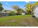 Large backyard with mature trees, partial fence, and lush greenery, offering a private outdoor space at 508 Brooker Rd, Brandon, FL 33511