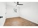 Bedroom featuring wood flooring, one window, and a ceiling fan at 508 Brooker Rd, Brandon, FL 33511