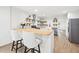 Modern kitchen featuring a light countertop, white cabinets, and stylish bar stool seating at 508 Brooker Rd, Brandon, FL 33511