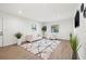 Spacious living room with ample natural light, stylish seating, wood-look flooring and modern decor at 508 Brooker Rd, Brandon, FL 33511