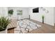 Bright living room featuring a cozy sitting area with stylish furniture, modern decor, and wood-look flooring at 508 Brooker Rd, Brandon, FL 33511