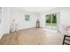 Bright living room with wood flooring and a sliding glass door to the backyard at 508 Brooker Rd, Brandon, FL 33511