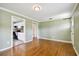 Bright living room with hardwood floors and view into the kitchen at 4320 3Rd N Ave, St Petersburg, FL 33713