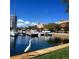 A white bird stands in a marina with boats and city buildings in the background at 4320 3Rd N Ave, St Petersburg, FL 33713