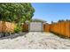 Garage with gravel driveway and wooden fence at 4320 3Rd N Ave, St Petersburg, FL 33713