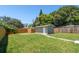 Large backyard with grassy lawn, shed and walkway at 4320 3Rd N Ave, St Petersburg, FL 33713