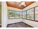 Sunroom with wood ceiling, tile floors and street view at 4320 3Rd N Ave, St Petersburg, FL 33713