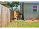 Side yard with wooden fence, mulch, and AC unit at 4320 3Rd N Ave, St Petersburg, FL 33713