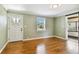 Living room featuring hardwood floors, light walls, and a view of the front yard at 4320 3Rd N Ave, St Petersburg, FL 33713