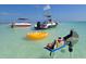 Floating BBQ grills and inflatables in shallow water at 4320 3Rd N Ave, St Petersburg, FL 33713