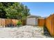 Garage with gravel driveway and wooden fence at 4320 3Rd N Ave, St Petersburg, FL 33713