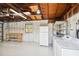 Garage with workbench, shelving, and laundry hookups at 4320 3Rd N Ave, St Petersburg, FL 33713