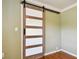 Modern barn door with frosted glass panels at 4320 3Rd N Ave, St Petersburg, FL 33713