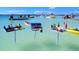 Multiple floating BBQ grills and food stations in shallow water at 4320 3Rd N Ave, St Petersburg, FL 33713