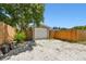 Garage with gravel driveway and wooden fence at 4320 3Rd N Ave, St Petersburg, FL 33713