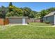 Backyard with a storage shed and wooden fence at 4320 3Rd N Ave, St Petersburg, FL 33713