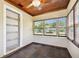 Sunroom with wood ceiling, tile floor and multiple windows at 4320 3Rd N Ave, St Petersburg, FL 33713