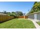 Large backyard with grassy area, shed, and wooden fence at 4320 3Rd N Ave, St Petersburg, FL 33713