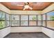 Bright sunroom with wood ceiling, tile floor and multiple windows at 4320 3Rd N Ave, St Petersburg, FL 33713