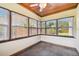 Sunroom with wood ceiling, tile floor and backyard view at 4320 3Rd N Ave, St Petersburg, FL 33713