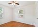 Simple bedroom with hardwood floors and two windows at 4320 3Rd N Ave, St Petersburg, FL 33713