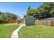 Large backyard with grassy lawn, shed and walkway at 4320 3Rd N Ave, St Petersburg, FL 33713