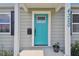 Inviting teal front door entryway with a charming porch at 4320 3Rd N Ave, St Petersburg, FL 33713