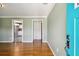 Living room with hardwood floors and view into kitchen at 4320 3Rd N Ave, St Petersburg, FL 33713