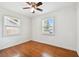 Well-lit bedroom with hardwood floors and two windows at 4320 3Rd N Ave, St Petersburg, FL 33713