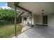Exterior of the house showing the front entrance and carport at 6199 59Th N Pl, St Petersburg, FL 33709
