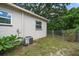 Home's backyard with a gate and AC unit at 6199 59Th N Pl, St Petersburg, FL 33709