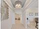 Bright entryway with light hardwood floors and a view into the living area at 9249 Highland Hills Dr, Hudson, FL 34667