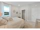Bright bedroom with a queen-size bed and walk-in closet at 9249 Highland Hills Dr, Hudson, FL 34667