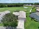 Aerial view of single-story house with golf course views at 10312 Cleghorn Dr, San Antonio, FL 33576