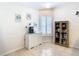 Dining area with window shutters, storage cabinet, and decorative wall art at 11247 Corey Pavin Ln, San Antonio, FL 33576