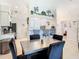 View of kitchen with a large table and chairs, and a breakfast bar with seating at 11247 Corey Pavin Ln, San Antonio, FL 33576