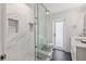 Modern bathroom with marble tile, glass shower, and stylish fixtures at 2049 Massachusetts Ne Ave, St Petersburg, FL 33703