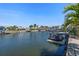 Wide canal view with a dock and multiple boats with clear blue sky in the background at 2049 Massachusetts Ne Ave, St Petersburg, FL 33703