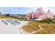 Beachfront property with pink hotel and beach umbrellas at 6269 Palma Del Mar S Blvd # 608, St Petersburg, FL 33715