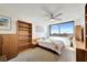 Bedroom with built-in shelving, a ceiling fan, and a view at 6269 Palma Del Mar S Blvd # 608, St Petersburg, FL 33715