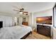 Bedroom with large window, ceiling fan, and a dresser at 6269 Palma Del Mar S Blvd # 608, St Petersburg, FL 33715