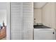 Bright laundry room with washer, dryer, and built-in storage at 6269 Palma Del Mar S Blvd # 608, St Petersburg, FL 33715