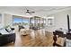 Living room with hardwood floors, sliding doors to balcony, and city views at 6269 Palma Del Mar S Blvd # 608, St Petersburg, FL 33715