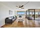 Bright living room with hardwood floors, balcony access, and city views at 6269 Palma Del Mar S Blvd # 608, St Petersburg, FL 33715
