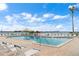 Inviting community pool with lounge chairs at 6269 Palma Del Mar S Blvd # 608, St Petersburg, FL 33715