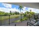 Private balcony overlooking a golf course and water at 5700 Escondida S Blvd # 306, St Petersburg, FL 33715