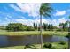 Scenic view of a peaceful waterway next to a lush golf course at 5700 Escondida S Blvd # 306, St Petersburg, FL 33715