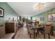 Spacious dining room with seating for multiple guests, open to living room at 5700 Escondida S Blvd # 306, St Petersburg, FL 33715