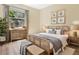 Main bedroom with light wood furniture and large window at 12433 Duckett Ct, Spring Hill, FL 34610